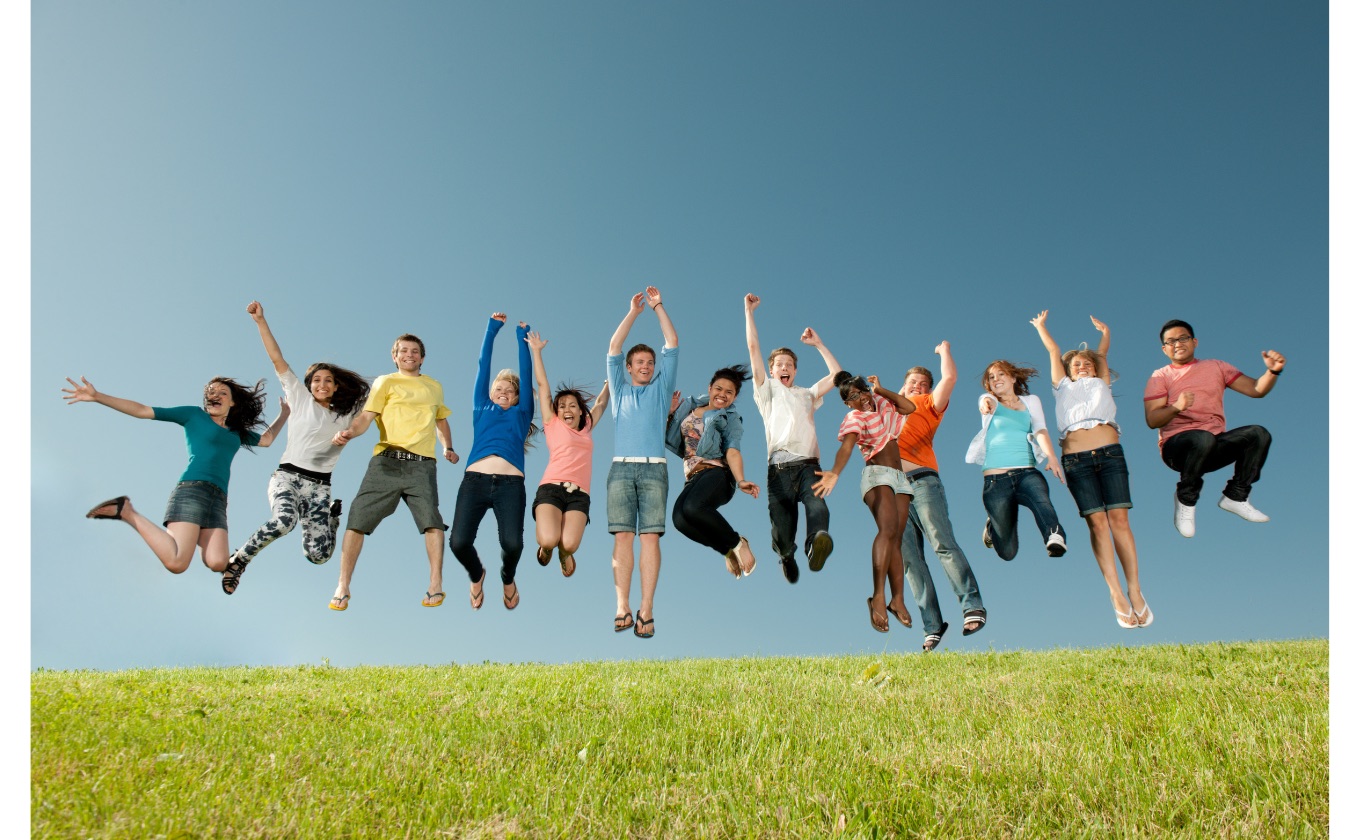 A diverse group of students celebrating together outdoors